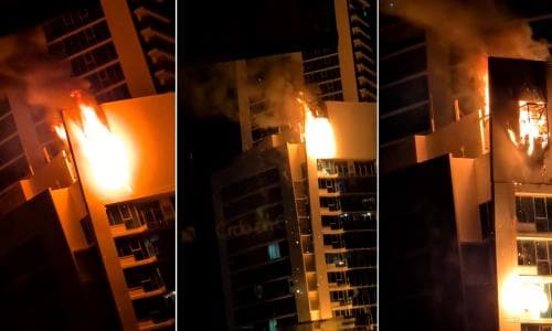 Hilton hotel at Surfers Paradise evacuated after fire broke out on roof